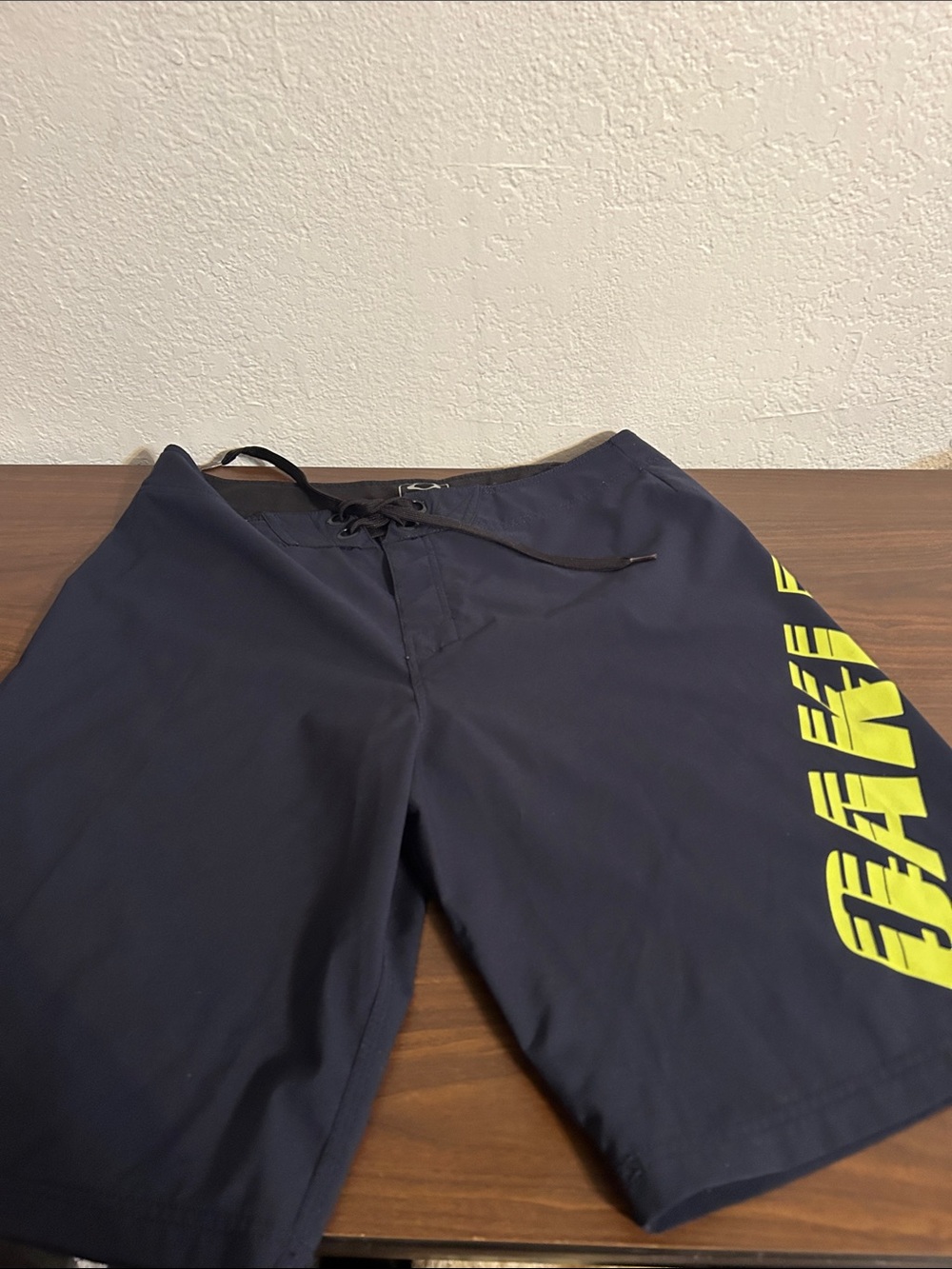 Oakley Navy Board Shorts with Yellow Side Graphic